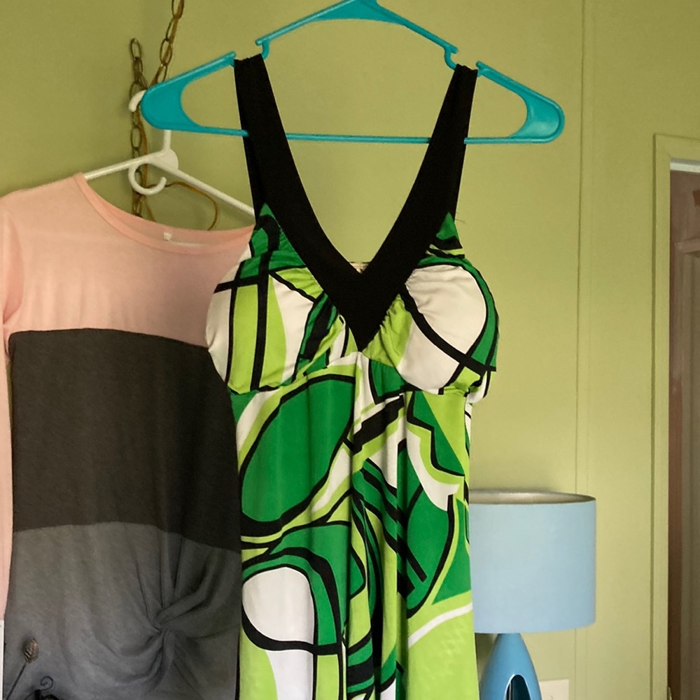 Asymmetrical top, slightly padded cups. Used in excellent shape.